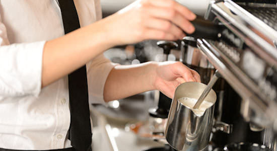 Barista steaming milk for hot chocolate Barista steaming milk for hot chocolate