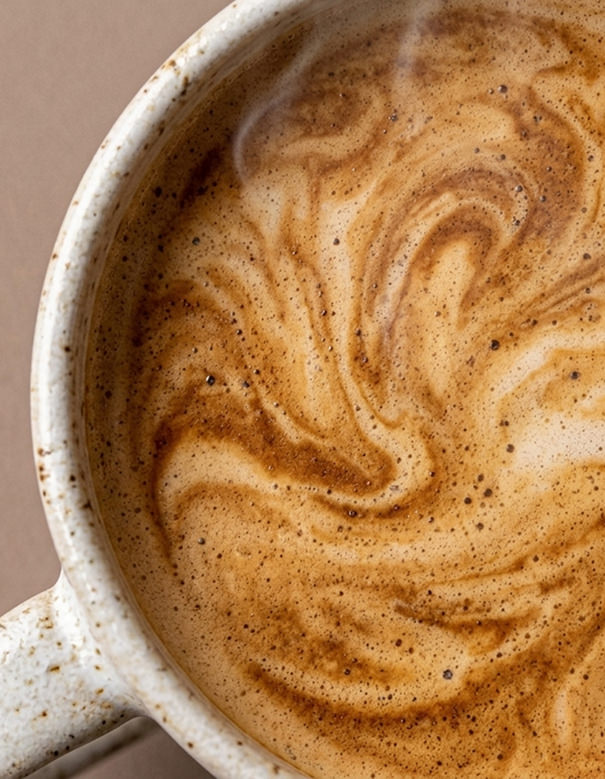 Close up shot of a hot coffee in a mug