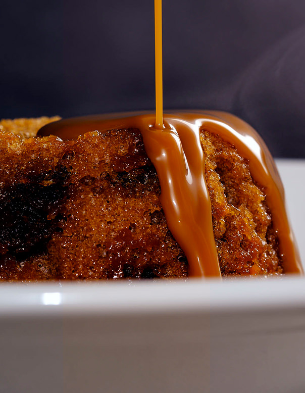 Chocolate ganache poured onto a chocolate cake